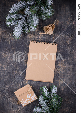 Christmas composition with empty craft notebook 94551589