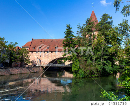 Old stone bridge in Nuremberg, Franconia, Germany. Old stone bridge in Nuremberg, Franconia, Germany. 94551756
