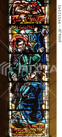 St Vincent de Paul sends evangelizers to the field workers, stained glass window in Basilica of the Sacre Coeur, dedicated to the Sacred Heart of Jesus in Paris St Vincent de Paul sends evangelizers to the field workers, stained glass window in Basilica of the Sacre Coeur, dedicated to the Sacred Heart of Jesus in Paris 94552345
