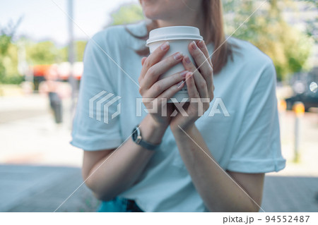 Cropped shot of an attractive young woman enjoying a cup of coffee in a cafe. Morning coffee in my favorite cafe.  94552487