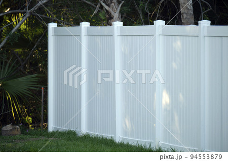 White plastic fence for back yard protection and privacy 94553879