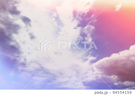 White clouds in bright sunlight. Revival of day. Clouds in glare of sun. 94554159