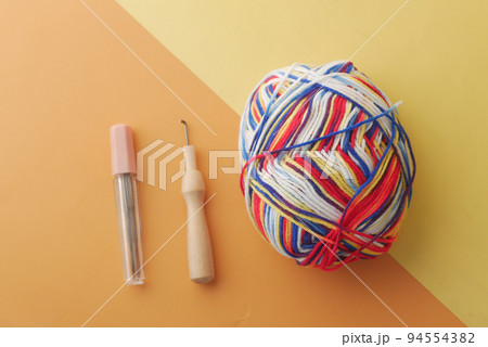 top view of multi color yarn on color background top view of multi color yarn on color background 94554382