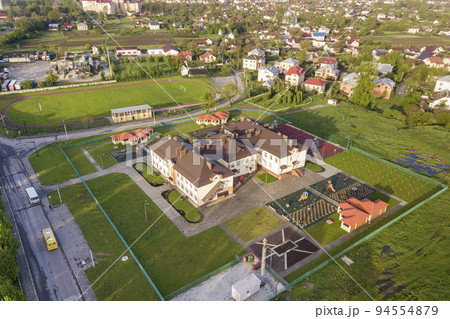 Aerial view of new prescool building in residential rural area. Aerial view of new prescool building in residential rural area. 94554879