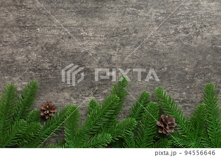 Christmas holiday background with copy space for advertising text. Fir branches and pine cone on color background . Flat lay, top view 94556646
