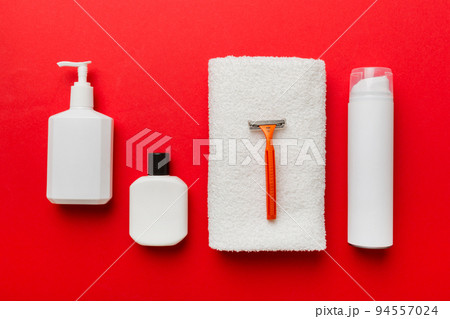 shaving man set. shaving machine, towel, lotion and shaving foam on colored background. Men bath Accessories top view shaving man set. shaving machine, towel, lotion and shaving foam on colored background. Men bath Accessories top view 94557024