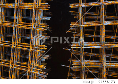 A pile of welded wire mesh rusty. A pile of welded wire mesh rusty. 94558173