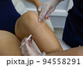 Beautician Giving Epilation Laser Treatment To Woman On Thigh. 94558291