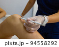 Beautician Giving Epilation Laser Treatment To Woman On Thigh. 94558292