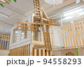 a public children's playground with a climbing house. 94558293