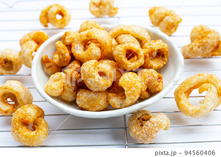 Crispy pork rinds or pork snack. 94560406