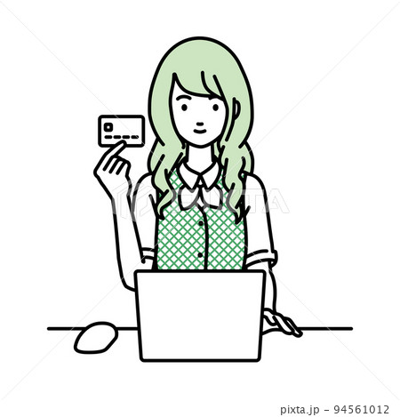 デスクで座ってPCを使いながらクレジットカードを手に持っている事務員制服の女性 94561012