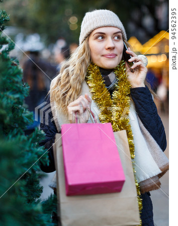 Woman talking on mobile phone at fair 94562395