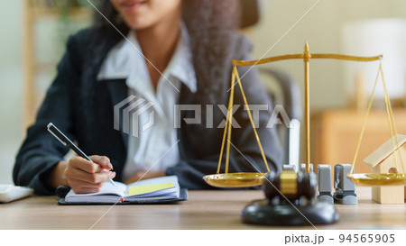 Lawyer business woman working or reading lawbook in office workplace for consultant lawyer concept 94565905