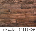 茶色の木目の粗い製材の古びた板壁の横長の背景画像 94566409