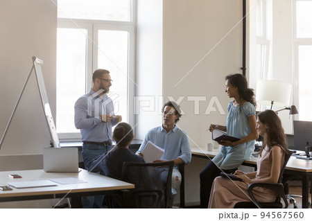 Happy confident business project leader man presenting marketing sales report Happy confident business project leader man presenting marketing sales report 94567560