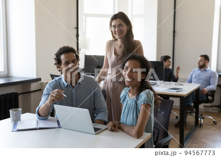 Happy business coworkers at laptop, diverse office employees corporate portrait 94567773