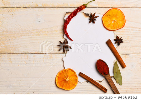 Food art concept. Composition of condiment on paper piece. 94569162