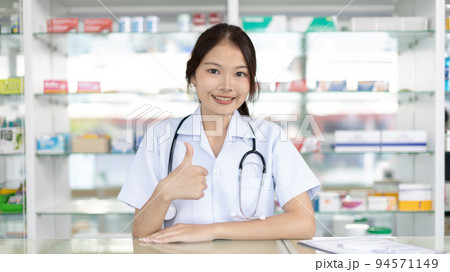 Pharmacist working in a pharmacy, Consultation and medical advice, All kinds of generic household drugs and pharmaceutical products on the shelf, Service and assistance to patients, Pharmacy. Pharmacist working in a pharmacy, Consultation and medical advice, All kinds of generic household drugs and pharmaceutical products on the shelf, Service and assistance to patients, Pharmacy. 94571149