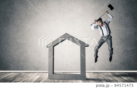 Stone home silhouette in empty room as symbol for real estae insurance 94571473