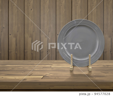 Ceramic plate in a wooden base in the kitchen. with space for text 94577028