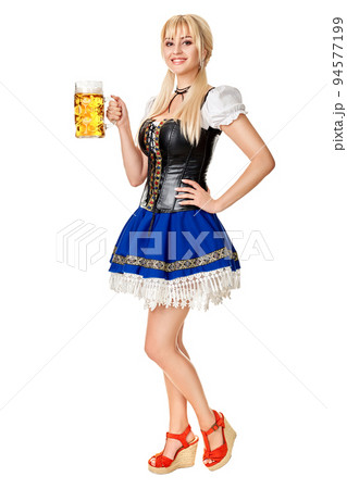 Full length portrait of a blond woman with traditional costume holding beer glasses isolated on white background. Full length portrait of a blond woman with traditional costume holding beer glasses isolated on white background. 94577199
