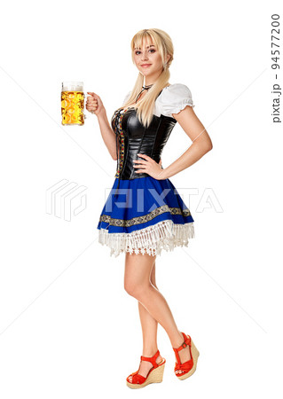 Full length portrait of a blond woman with traditional costume holding beer glasses isolated on white background. Full length portrait of a blond woman with traditional costume holding beer glasses isolated on white background. 94577200