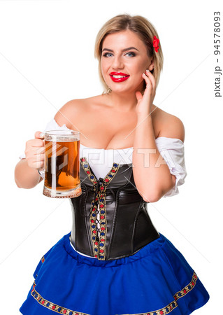 Beautiful young blond girl of oktoberfest beer stein 94578093