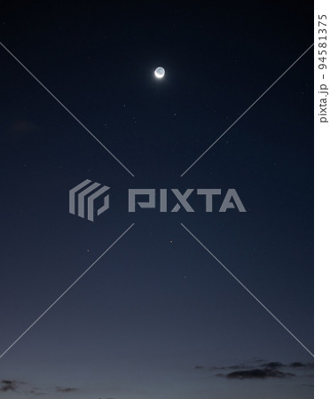 Moon and stars shiny in blue sky at night 94581375