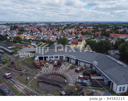 Aerial view of colorful freight trains on the railway station. Aerial view of colorful freight trains on the railway station. 94583215