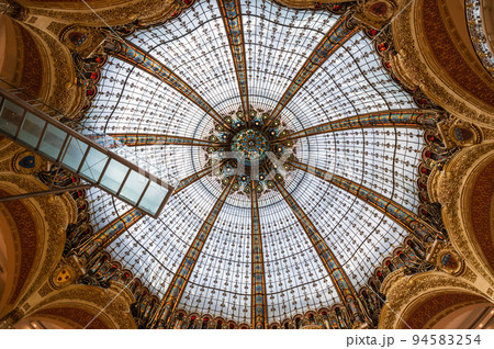Beautiful dome in Galeries Lafayette in Paris, France. Art nouveau or Art deco style stained glass 94583254