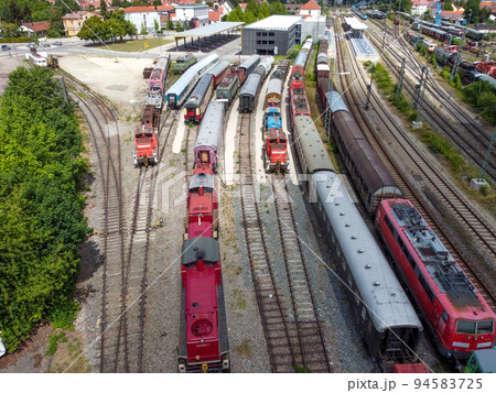 Aerial view of colorful freight trains on the railway station. Aerial view of colorful freight trains on the railway station. 94583725