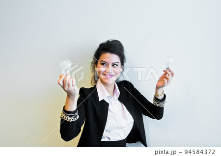 Business woman hold light bulb on white background Business woman hold light bulb on white background 94584372