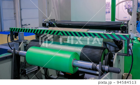 Automatic plastic bag making machine - roller with green polyethylene film Automatic plastic bag making machine - roller with green polyethylene film 94584513