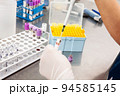 Scientist preparing bone marrow samples for flow cytometric analysis in the laboratory. 94585145