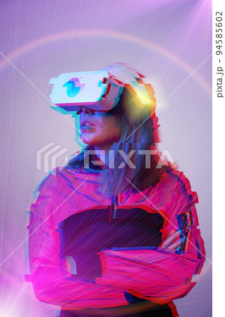 Woman is using virtual reality headset. Concept of virtual, augmented and extended reality and metaverse. 94585602