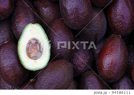 Fresh ripe purple avocado on retail display 94586111