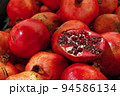 Fresh red ripe pomegranates close up 94586134