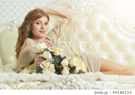 Young beautiful woman waking up on bed 94586154