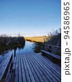 View of a wooden pier on a large crayfish lake. State Natural Reserve Cancer Lakes, St. Petersburg. 94586965