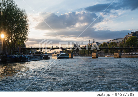 Sunset at Pont des Arts, Paris, France or Passerelle des Arts is a pedestrian bridge that has an international reputation as the bridge of romance. Sunset at Pont des Arts, Paris, France or Passerelle des Arts is a pedestrian bridge that has an international reputation as the bridge of romance. 94587588