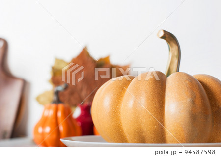 Pumpkins on light background. Serving, cooking, recipes for autumn dishes. Pumpkins on light background. Serving, cooking, recipes for autumn dishes. 94587598