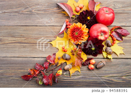 Composition of colorful fruits, berries, cones. Top view on wooden background. Autumn flat lay. Composition of colorful fruits, berries, cones. Top view on wooden background. Autumn flat lay. 94588391