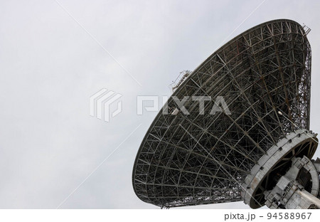 The silhouette of a satellite dish or radio antenna. Space observatory or air defense radar 94588967