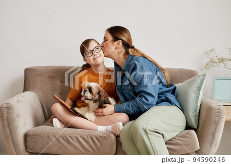 Mother Kissing Daughter With Down Syndrome Mother Kissing Daughter With Down Syndrome 94590246