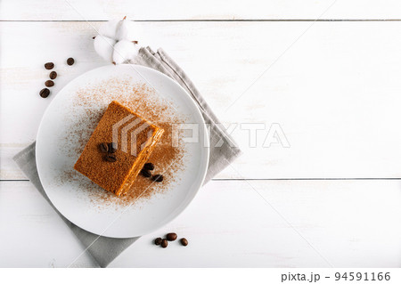 Traditional Italian dessert tiramisu on light background. Traditional Italian dessert tiramisu on light background. 94591166