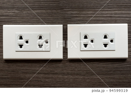 asia plug socket on wooden wall asia plug socket on wooden wall 94599319