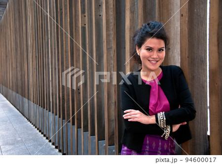 Business woman with Thai silk dress and formal suit Business woman with Thai silk dress and formal suit 94600017