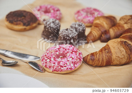 Donuts, croissants and sweets on craft paper 94603729