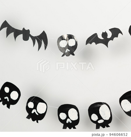 Bats and skulls black on white background, place to write greeting. 94606652